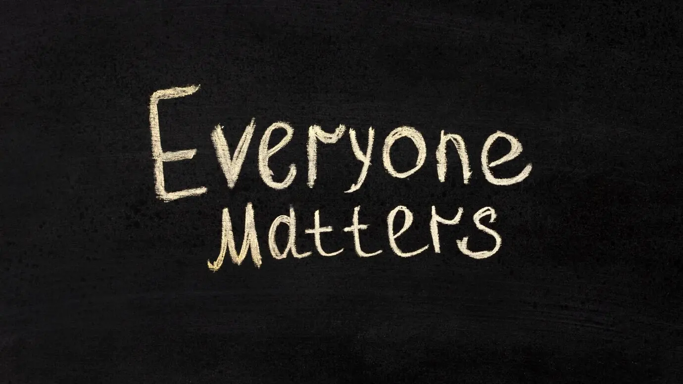 The inclusion concept “Everyone matters” on a chalkboard.